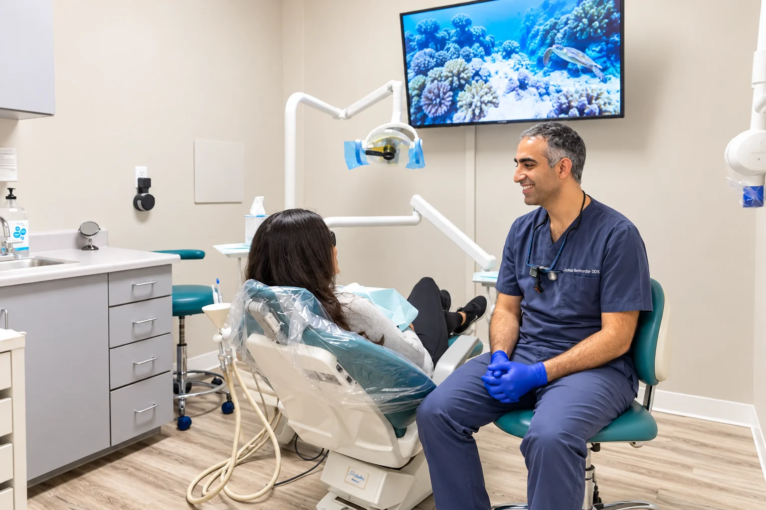 Dr. Barkhordar treating a patient in a modern operatory